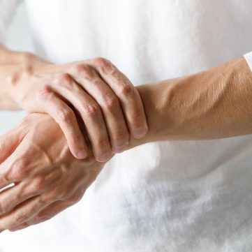 Closeup,Of,Male,Arms,Holding,His,Painful,Wrist,Caused,By Closeup,Of,Male,Arms,Holding,His,Painful,Wrist,Caused,By